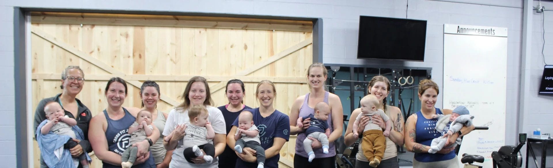 A group of moms working out together at The Forge, part of Postpartum Fitness in Milford.